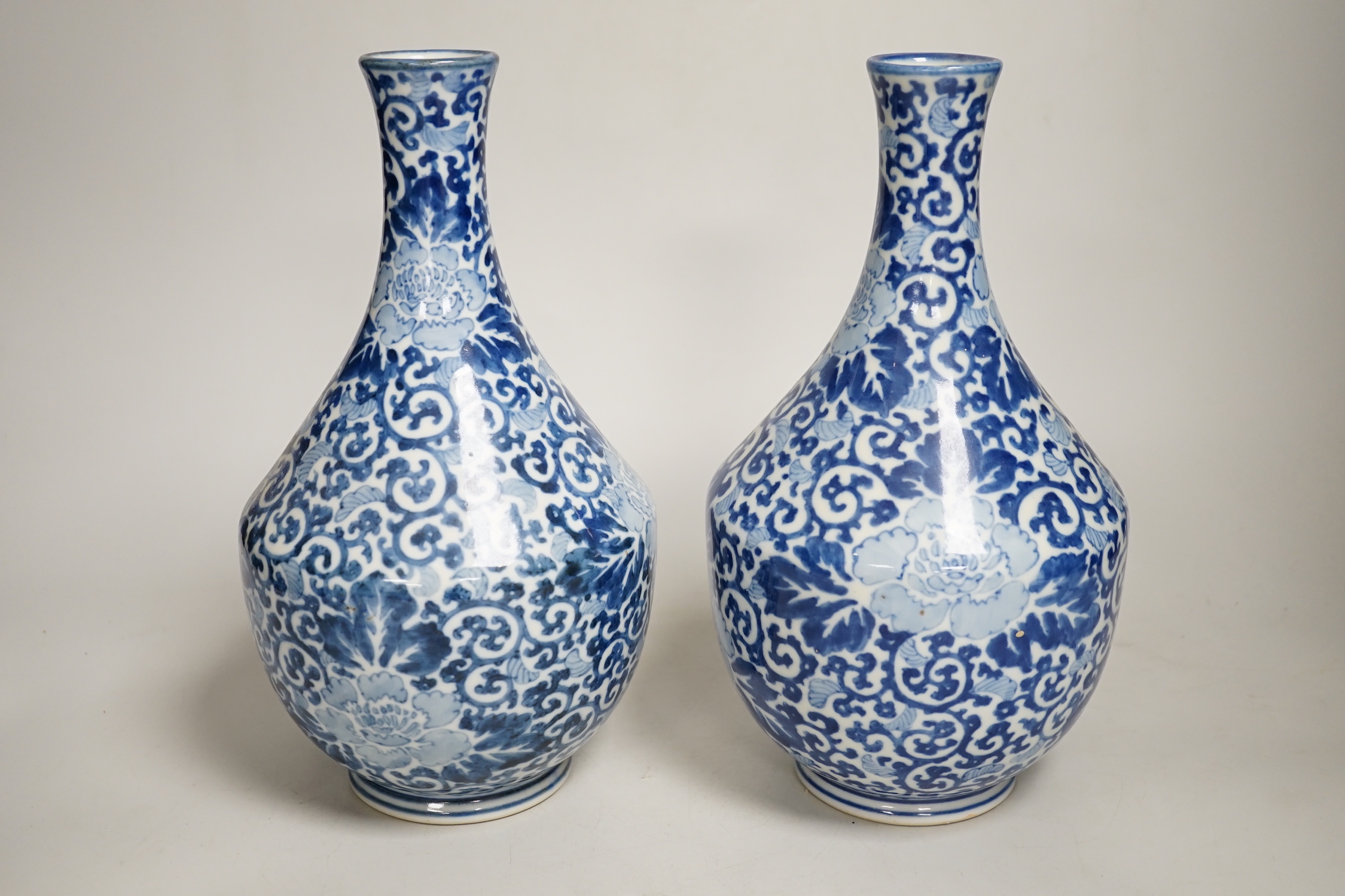 A pair of Chinese blue and white vases, 26cm high